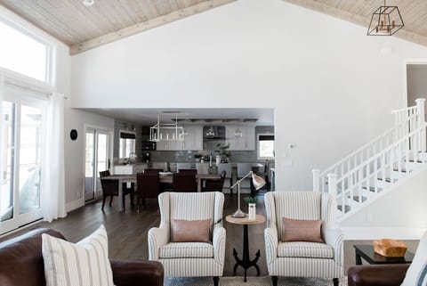 The great room conveniently adjoins the dining room and open concept kitchen