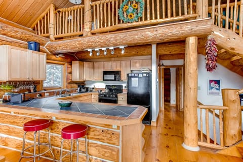 The home feature full exposed logs throughout the home.