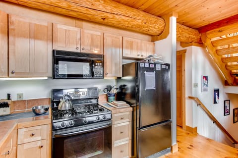 The large spacious kitchen has everything you will need to cook your meals for your stay.