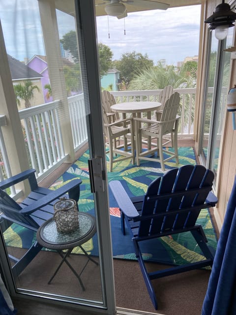 Screened Porch View from Primary Bedroom with Pollywood Furniture