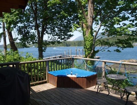 Jacuzzi soaker tub on the deck & BBQ & bistro set.