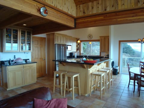 The kitchen island seats 5 and is a fun place to gather and watch the cook.