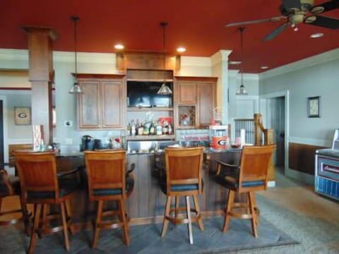 Bar on lake level' 1969's Jukebox loaded with records and TV over bar; Icemaker