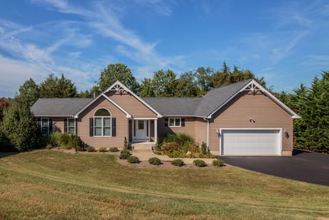 Driveway parking for 4 cars, plus boat trailer parking at top of driveway