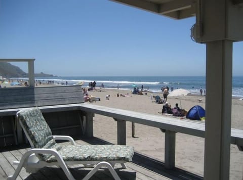 The rope off beach area is off the deck steps in the Summer time.