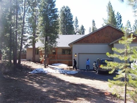 1800 sq ft home set back from the street with rustic forest in the front yard 