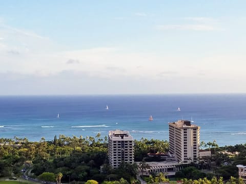 view of sail boats off Waikiki beach from window
