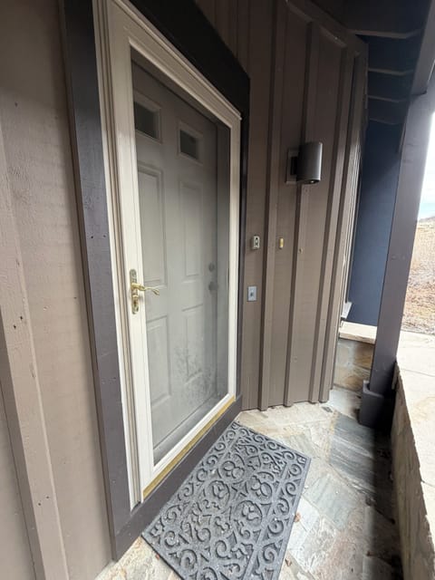 Front door, off the street and covered.