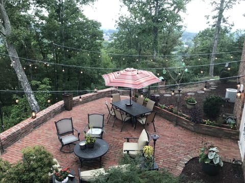 Back brick patio overlooking the city lights of Bristol. 