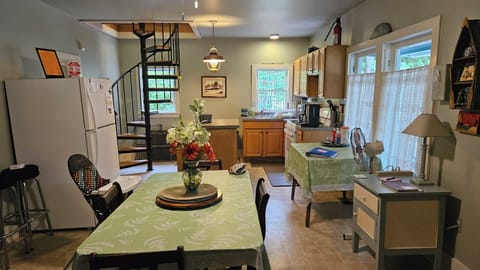 Kitchen and family eating area; spiral staircase; view from living room