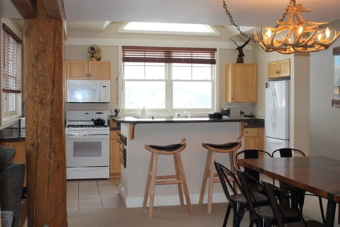 view of kitchen with dining to the left and living room to the right
