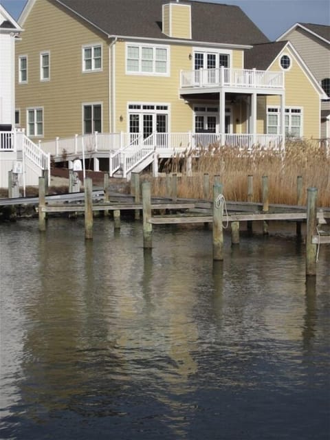 View of back of the house and boat slip and dock
