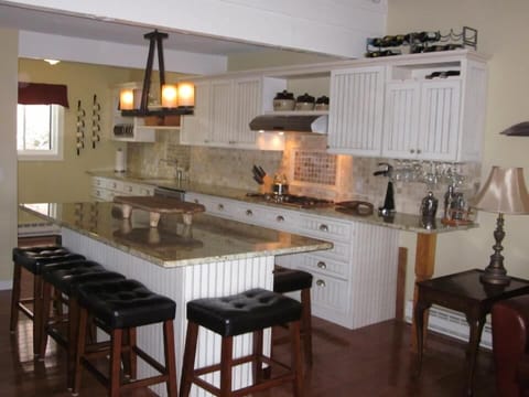 Gourmet kitchen with seating for 8 at the center island.