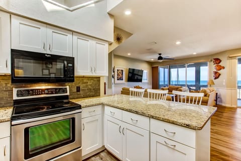 Kitchen bar area with view beyond to the ocean.