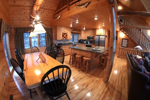 Main Level Dinning Room - wooden table seats 8, counter seats an additional 6