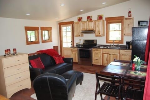 Studio apartment above garage with full kitchen, queen bed, & private bath.