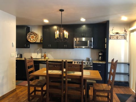 Dining Room/Kitchen Fully Stocked with Glassware, dishes, cookware, much more.