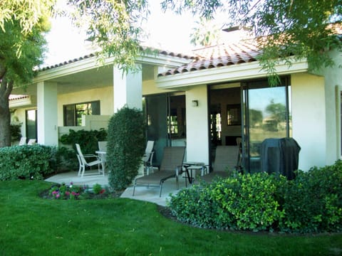 Rear patio with loungers and bbq