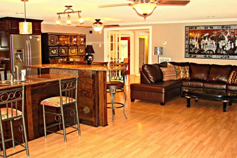 Main entrance, bar, and open kitchen/dining/living area. Great for gatherings!