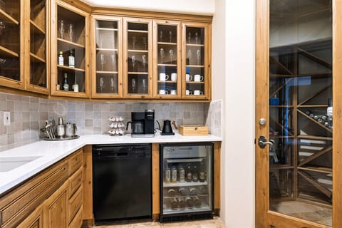 Butler's pantry with wine room. Keurig coffee pods and pot coffee options.