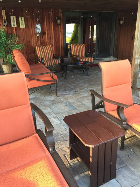 Outside lower stone patio overlooking lake
