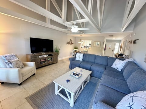 Cozy and spacious living & dining area. 65" smart TV