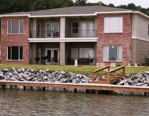 Back Patio to Lake-Lower Left Unit, boardwalk to fish, swim & benches to sit on.