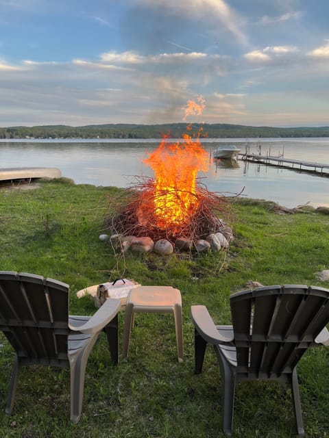 End your day with lakeside fires, glowing sunsets, and calm water views 