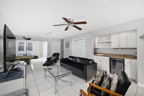 Pool table and living room. Plenty of game activities for the guests