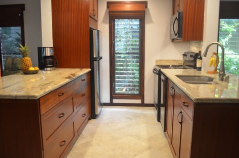 Two island kitchen with 36 inch granite counter tops. Windows open for fresh air