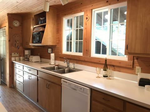 Kitchen in main house including dishwasher and microwave