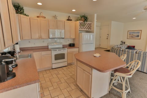 Convenient island. Perfect to put out snacks & appetizers. Storage underneath