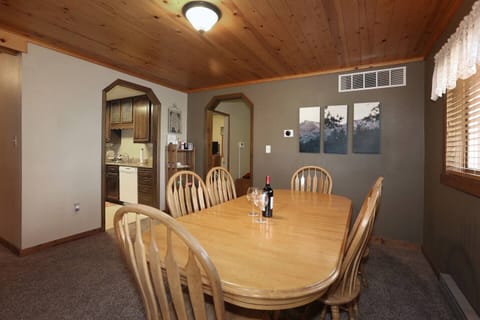 Large dining table just outside Kitchen