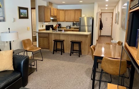 Kitchen at back, wall coat rack, spacious hall for shoe storage, exterior door