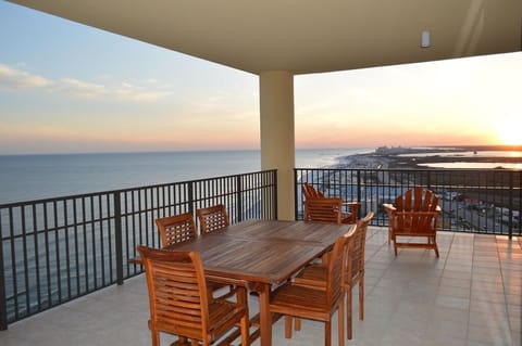 Balcony retreat with teak table and comfy deck furniture; just add you!