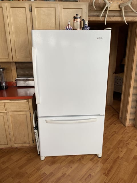 Huge refrigerator. No ice maker so bring lots of ice!