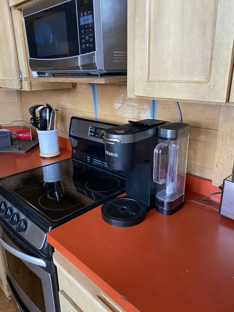 Keureg for singles or pot of coffee, other small appliances in the closet.
