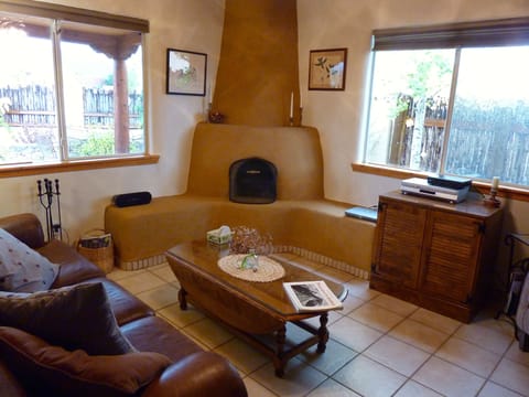 The living room with kiva fireplace.