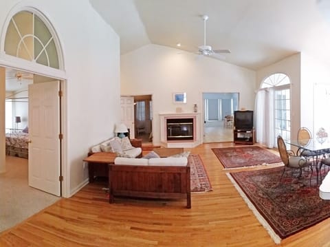 Living room from front door. To the left is master suite. Twin BR & Back porch.