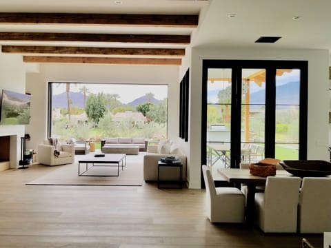 Doors seamlessly open up to multiple patios-Stunning indoor/outdoor living.