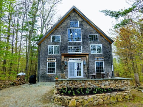 Front of the house with the granite and flagstone patio facing the lake.
