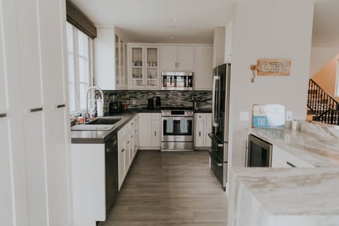Fully-stocked kitchen with stainless steel appliances