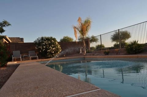 Nice water feature in the pool makes relaxing in the back yard even that much better