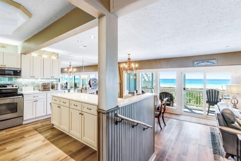 Wall of windows looking out at beautiful beach views
