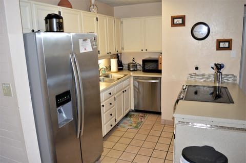 Fully equipped kitchen with stainless appliances. 