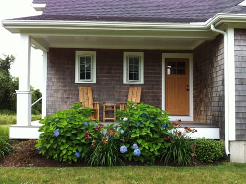 Front deck with cedar chairs and table