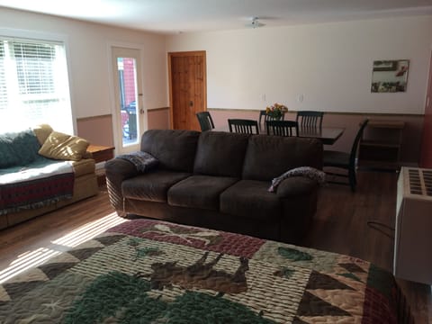 Dining table easily seats 6 without the leaf. Lots of extra chairs.