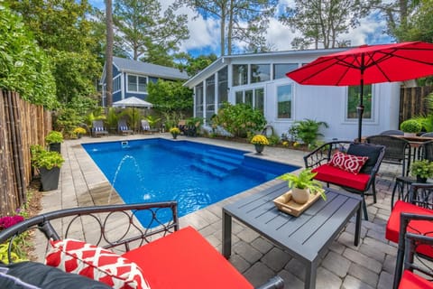 This private oasis includes a 12x27 in-ground pool, complemented by stunning hardscaped areas that enhance its beauty.