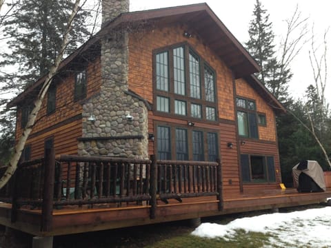 Back view from the lake with the outdoor fireplace.
