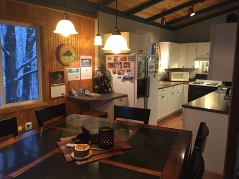 Dining Area to Fully-Stocked Kitchen.